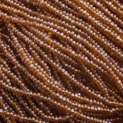 13/0 Charlotte Cut Preciosa (Czech) Bead Transparent Dark Topaz Lustre Strung