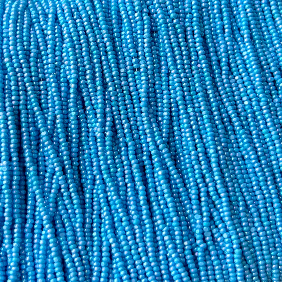 13/0 Charlotte Cut Preciosa (Czech) Bead Opaque Light Blue AB Strung